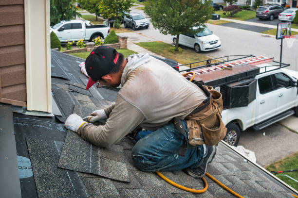 Professional Roof Replacement technician working in Saint Ann, MO